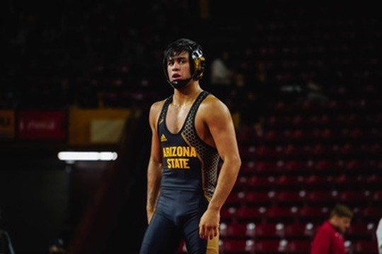 An Arizona State wrestler waiting between whistles