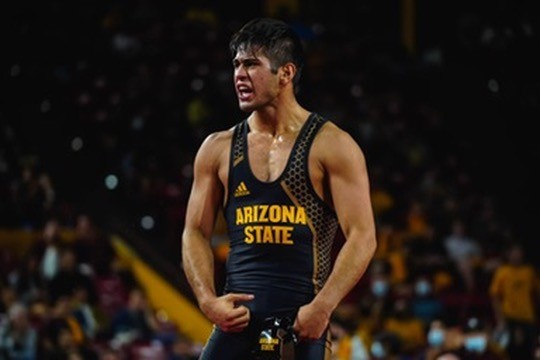An Arizona State wrestler fired up after a win